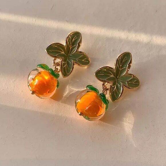Anthropologie Jewelry - Persimmon glass earrings